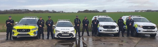 Officers and police cars line up for a photo before going out on duty for a day of action in Braintree and Uttlesford districts