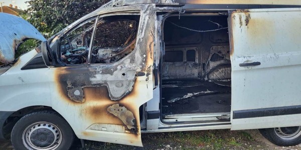 Burnt-out white van