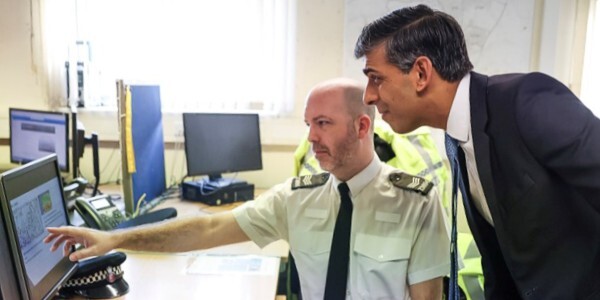 Sgt Gavin Tuck discusses Operation Dial with the Prime Minister. Photo: Simon Dawson/10 Downing Street