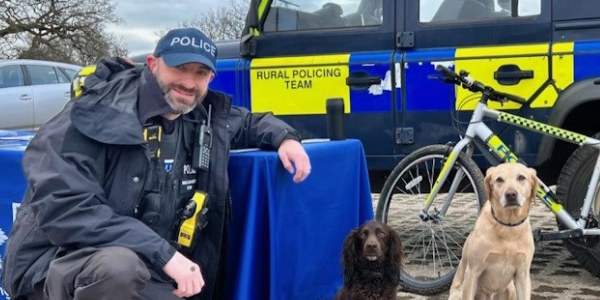 Rural officer with dogs and landrover