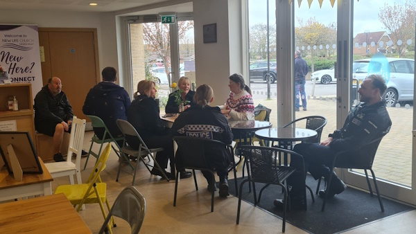 Officers and members of the public seated talking about local concerns 