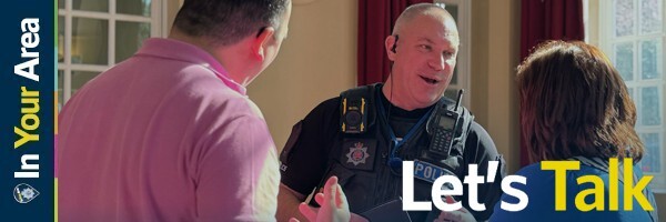 Officer talking to members of the public at an event - Let's Talk