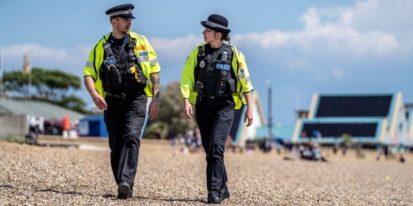Two officers patrolling along the beach in Southend