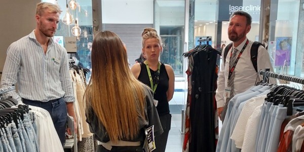 Staff from Chelmsford For You BID and East of England Co-op discuss staff safety with PC Mike Lee.