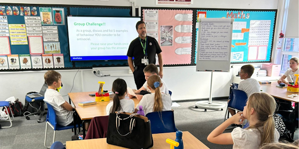 Officer giving a presentation to year 6 children