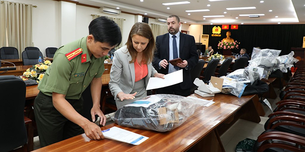 Ch Supt Stuart Hooper and DI Michel Stoten return the victims' possessions in Vietnam