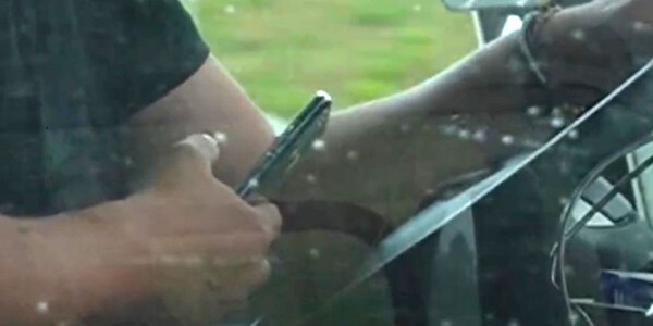 Someone using a mobile phone whilst driving