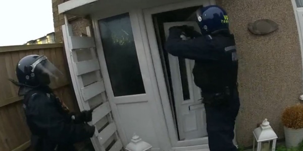 Officers entering a property