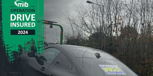 Operation Drive Insured 2024 photo of car with a 'seized by police sticker on the rear window