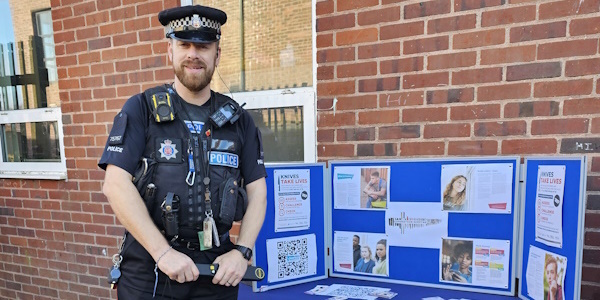 PC Braden standing next to a display board