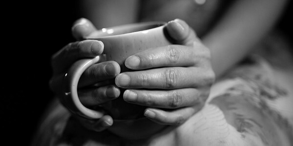 Female hands holding a mug
