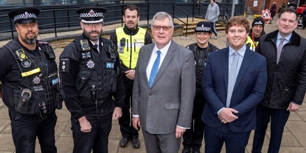 DCC Prophet, PFCC Roger Hirst, Cllr Dan Swords and Cllr Joel Charles with officers from Harlow CPT and the council's community safety team.