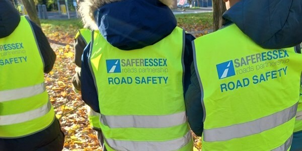 Yellow tunics with the Safer Essex logo 'Road Safety' worn by children conducting Speedwatch checks