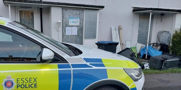Police car parked outside the address subject to a closure order