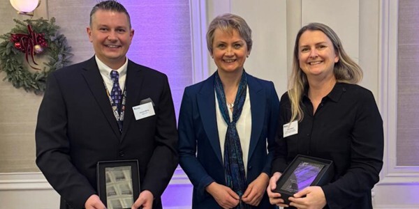 Volunteer Richard Wicks, left, and SC Claire Walters, right, with Home Secretary Yvette Cooper at the Lord Ferrers Awards ceremony