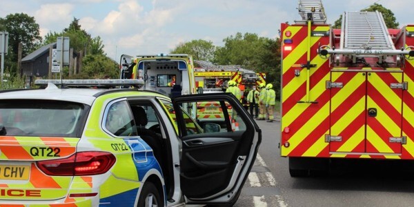 Police car, ambulance and fire engine attending a serious road collision