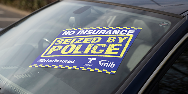 car with seized by police sticker on windscreen