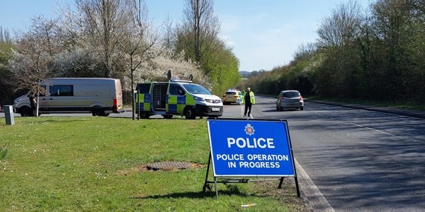 Police speed detection van in Epping Forest area with sign saying 'Police Operations In Progress'