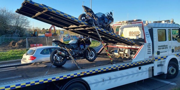 Two of the motorcycles which were seized by officers on a recovery lorry