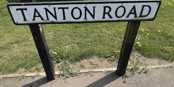 Picture of street sign saying Tanton Road