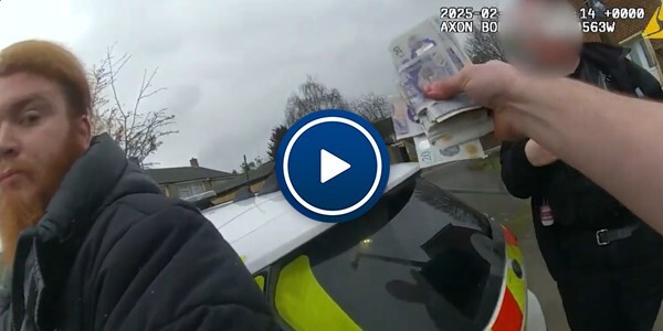 Body worn video footage of a stop and search. Officers taking drugs and cash from a man.