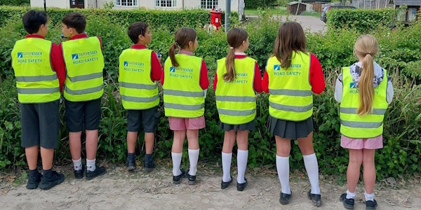 Group of children in high visibility vests
