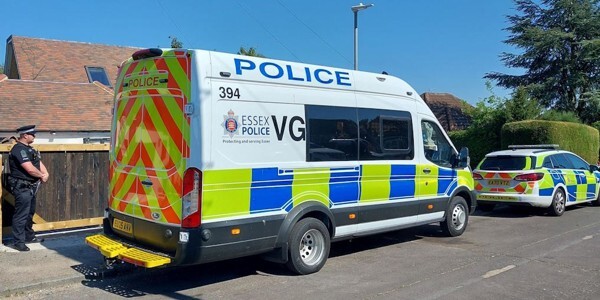 Police vehicles and a police officer outside a property in Billericay