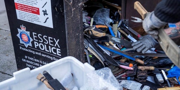 A knife bin being emptied