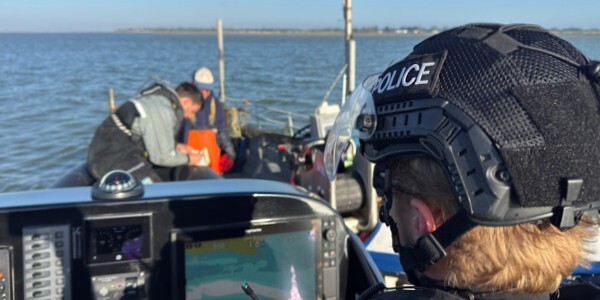 Marine Unit officers working with partners inspecting fishing gear and nets