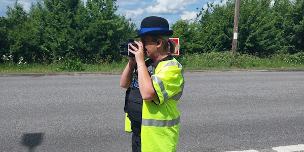 PCSO Holding a speed monitoring device