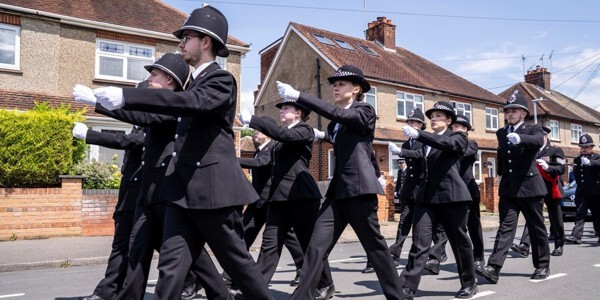 New police officers marching in dress uniform