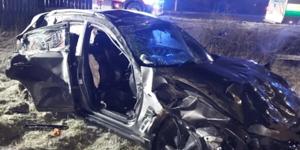 Badly damaged car at night