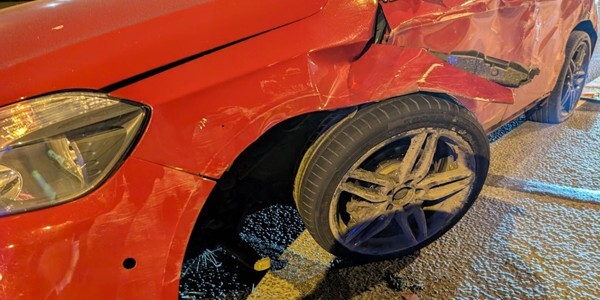 Damage to a red car