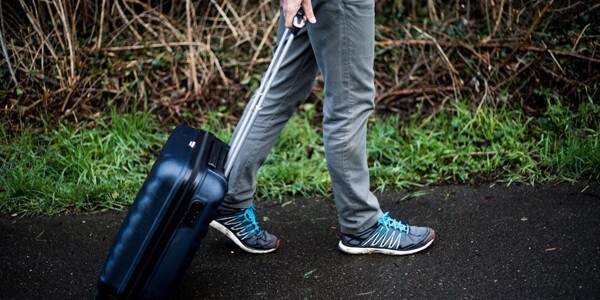 Cadet with a pull-along suitcase ready to test hotels alongside officers