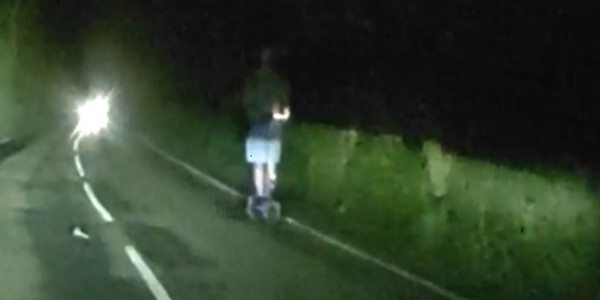 A privately-owned e-scooter without lights on the dark, unlit A131 with a 60 MPH speed limit