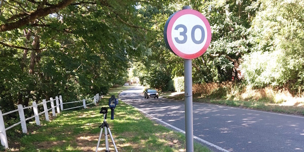 Picture of 30mph sign with a speed device on a tripod