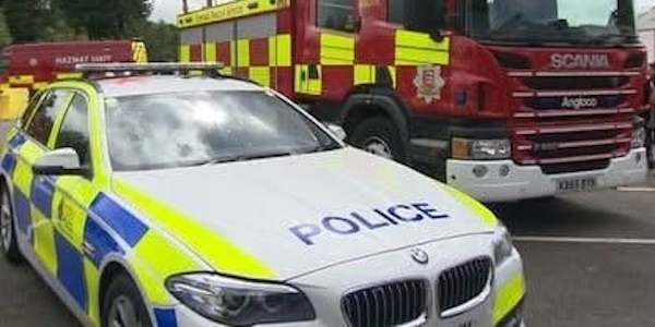 Police vehicle parked next to a Fire engine