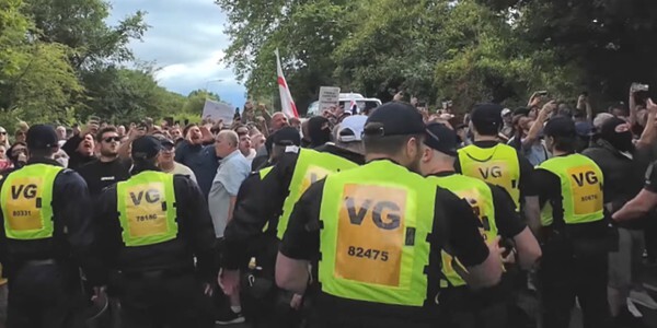Police officers and protestors in Epping