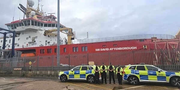 Officers with patrol cars strike a pose in front of the Sir David Attenborough aka Boaty McBoatface