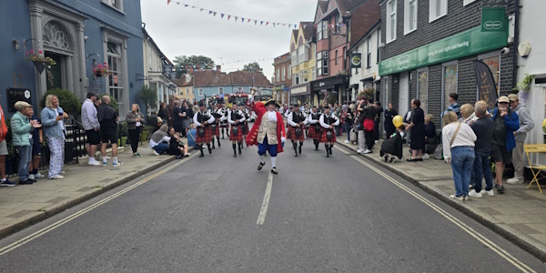 Dunmow Carnival Parade with members of the public lining the streets