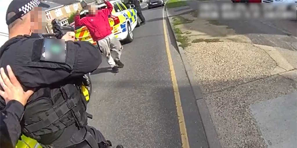 Armed officer stops suspect