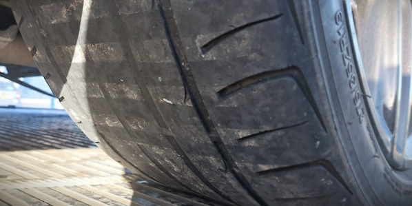 underside view of a set of bald tyres