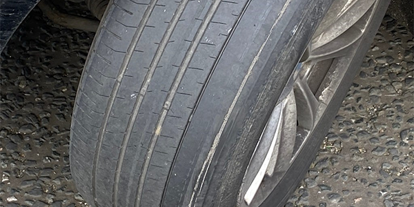 A bald and split car tyre