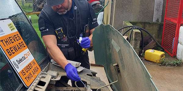 police officer DNA property marking farming equipment