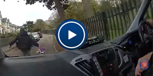 Video from an officer's body worn video camera of shoplifter from inside a police car