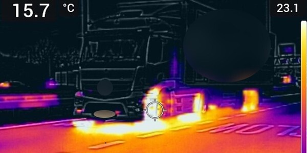 Infra-red inspection camera orange and black view of a commercial vehicle.