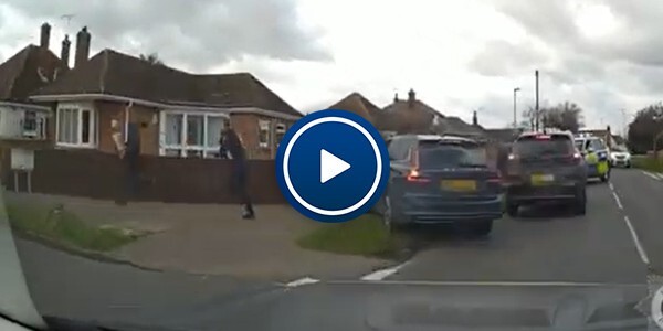 Men running with police officers in pursuit