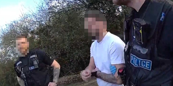 Officers with arrested man