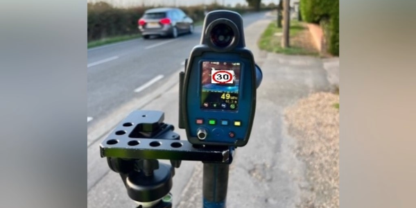 Speed check machine monitoring a road 
