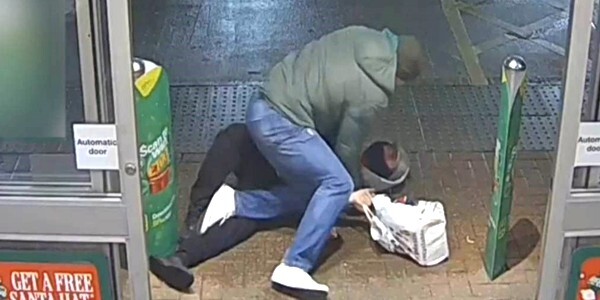 Plain-clothes detective detaining shoplifter - caught on the shop CCTV camera